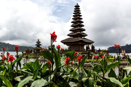 Balinese temple on the lake, flowers aroundの写真素材