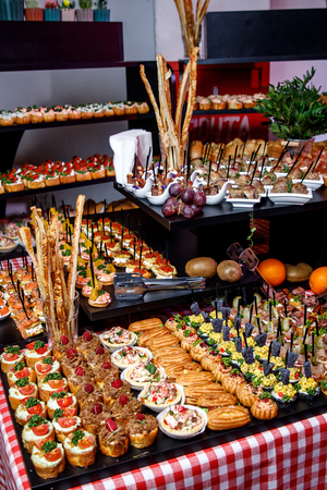 A lot of different snacks on event catering.の写真素材