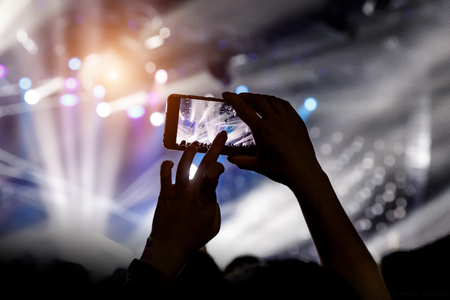 Shooting on mobile phone. Concert on stageの写真素材