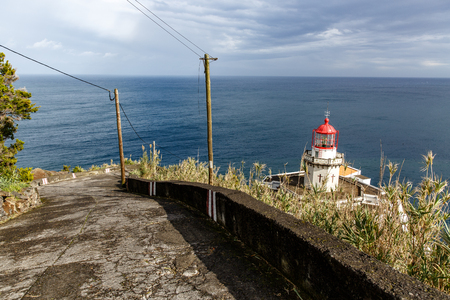 Old lighthouse on the shore.の写真素材