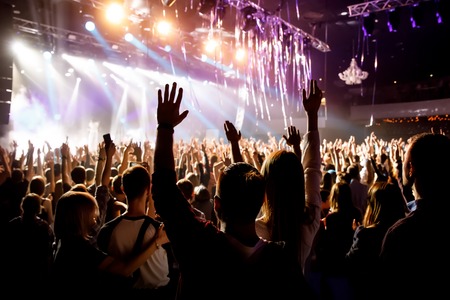 Crowd with raised hands on music concert.の写真素材