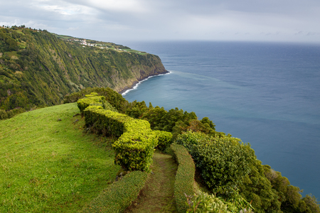 Meadows near ocean. San Miguel, Azores. Walking trail along the seaの写真素材