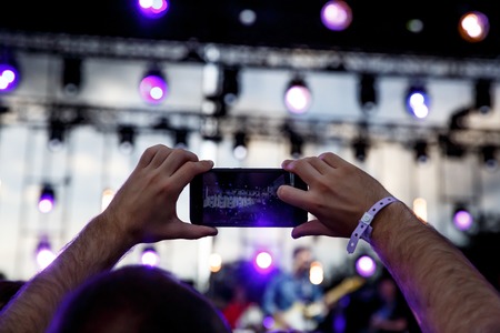 Take a picture on concert, smartphone recordの写真素材