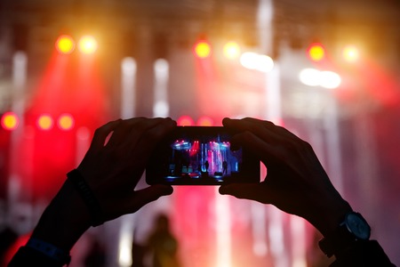 Take a picture on concert, smartphone recordの写真素材