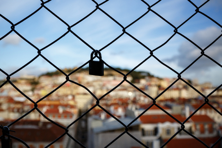 Lock on the cage, Old city on a blurredの写真素材