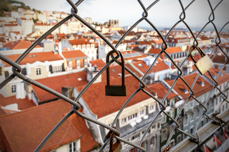 Lock on the cage, Old city on a blurredの写真素材