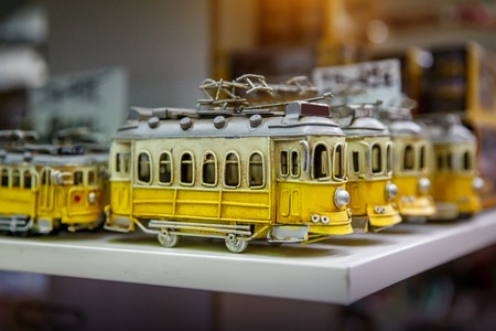 Symbol of Lisbon, a toy of the traditional yellow tram in souvenir shopの写真素材