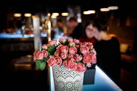 Bouquet of carnations in a city cafe.の写真素材