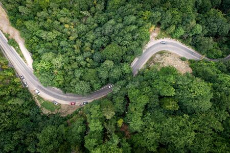 Top view of frequent turns of the road, Romaniaの写真素材