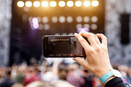Recording outdoor music concert on a mobile phoneの写真素材