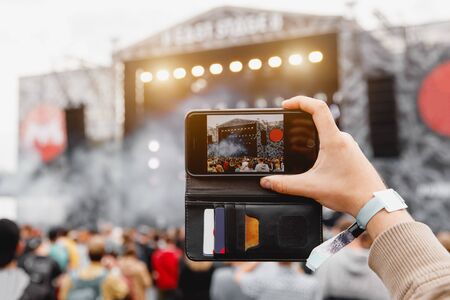 Recording outdoor music concert on a mobile phoneの写真素材