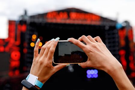 Recording outdoor music concert on a mobile phoneの写真素材