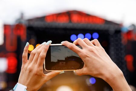 Recording outdoor music concert on a mobile phoneの写真素材