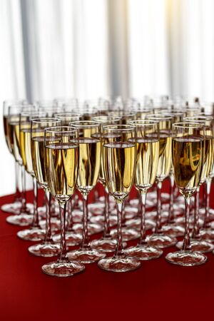 Elegant champagne glasses at a Christmas partyの写真素材
