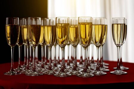 Elegant champagne glasses at a Christmas partyの写真素材