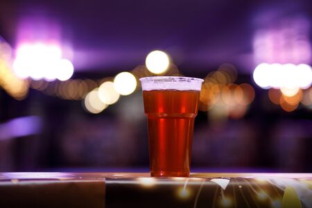 Glass with beer on a festive backgroundの写真素材