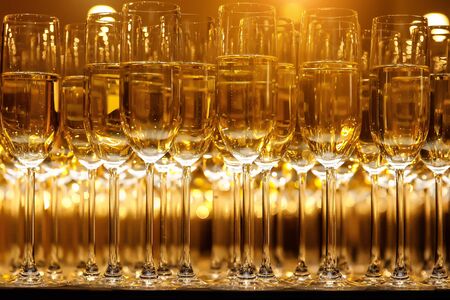 Elegant champagne glasses at a Christmas partyの写真素材