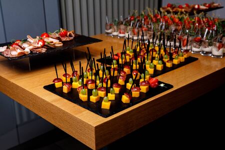 Different snacks and appetizers ready for a cocktail party. Catering concept.の写真素材