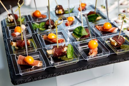 Different snacks and appetizers ready for a cocktail party. Catering concept.の写真素材