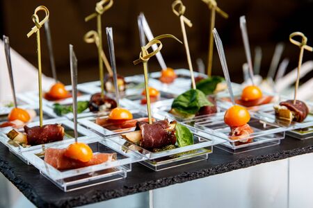 Different snacks and appetizers ready for a cocktail party. Catering concept.の写真素材