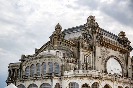 Beautiful old building on a background of dramatic cloudsの写真素材