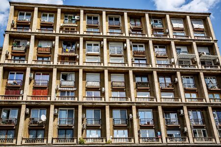 Facade of a residential building with balconies and air conditioningの写真素材