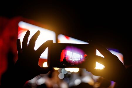 Supporters recording at concert - candid image of crowd at rock concertの写真素材