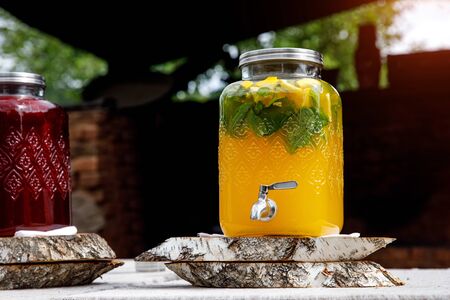 Jugs of lemonade at the summer outdoor partyの写真素材
