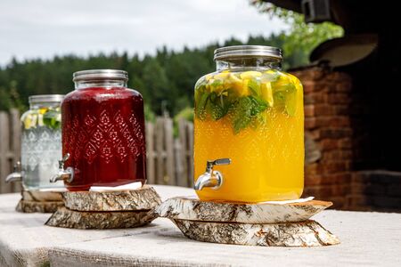 Jugs of lemonade at the summer outdoor partyの写真素材