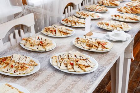 A lot of closed pizza slices on event cateringの写真素材