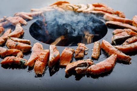 Image of fried fish. Pieces of fish fillet fried on fire.の写真素材