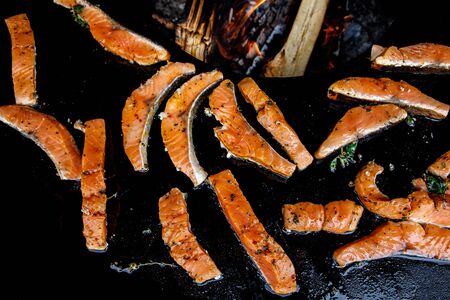 Image of fried fish. Pieces of fish fillet fried on fire.の写真素材