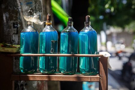 Bottles of gasoline petrol on Bali streetの写真素材