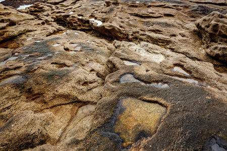 Texture of coastal old stone. Rock wallpaper