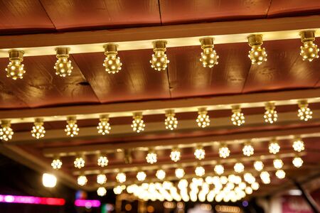 The row of incandescent bulbs. Lights backgroundの写真素材