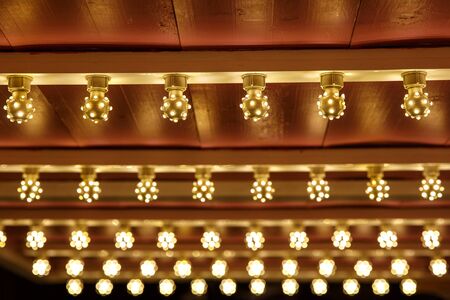 The row of incandescent bulbs. Lights backgroundの写真素材