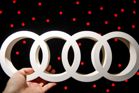 Warsaw, Poland - 30.01.2019: AUDI brand icon in handのeditorial素材