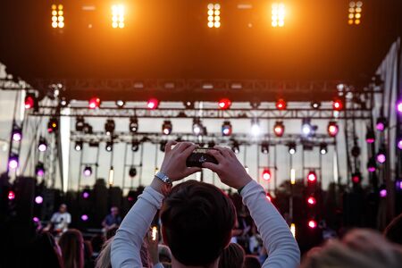 Live stream for social networks at a concert. Using a smartphone cameraの写真素材
