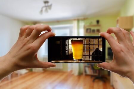 Bar via the internet. Using technologies for online drinking at home with friendsの写真素材