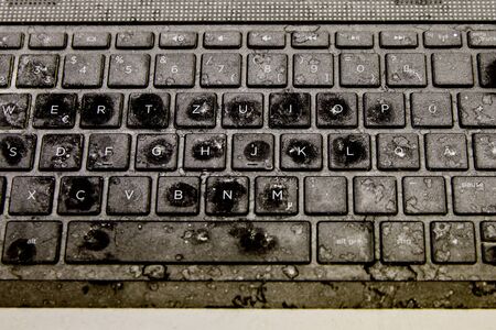 Old damaged and dirty keyboardの写真素材