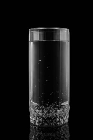 Glass of water on a black backgroundの写真素材