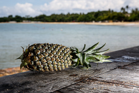 Pineapple on a beach background