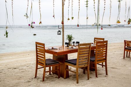 Cafe by the sea. Wooden furniture and decorations.の写真素材