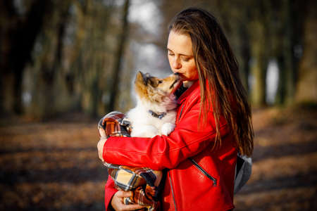 Portrait girl with pet. The dog kissing his ownerの写真素材