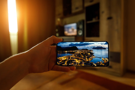 Norway city Aalesund on the screen. View famous tourist spots from home via smartphone. Online travel conceptの写真素材