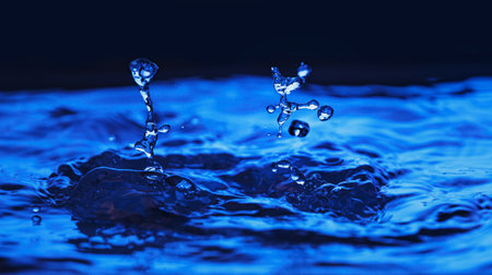 Blue water splashing. Liquid dropsの写真素材