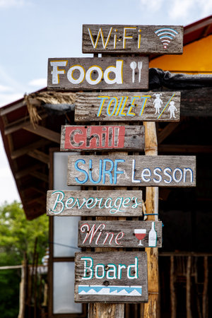 Plates with different offers services on the beachの写真素材