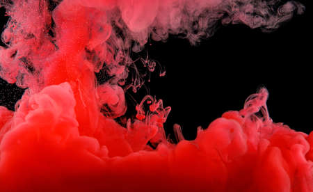 Red abstract texture on black. Ink wavesの写真素材