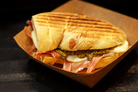 Sandwich with bacon and spinach in a cardboard boxの写真素材