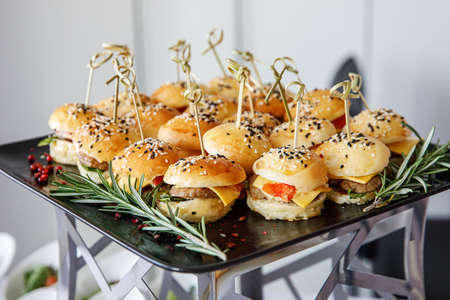 Close-up burgers at catering event.の写真素材